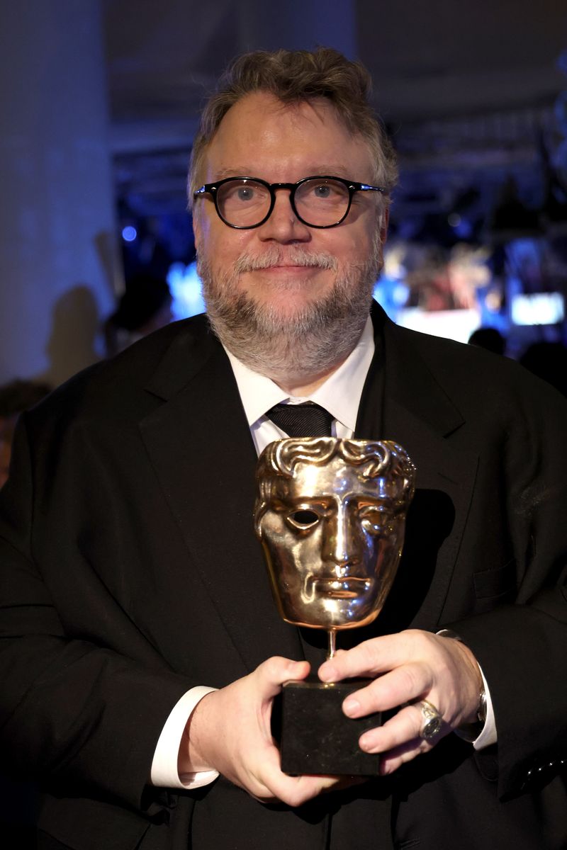 Director Guillermo del Toro poses with the Best Animated Film award during the EE BAFTA Film Awards 2023 Dinner.