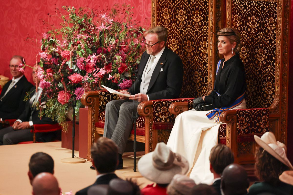 The Queen opted for a long-sleeved black blouse paired with a full white skirt, pieces she has previously worn for formal engagements.