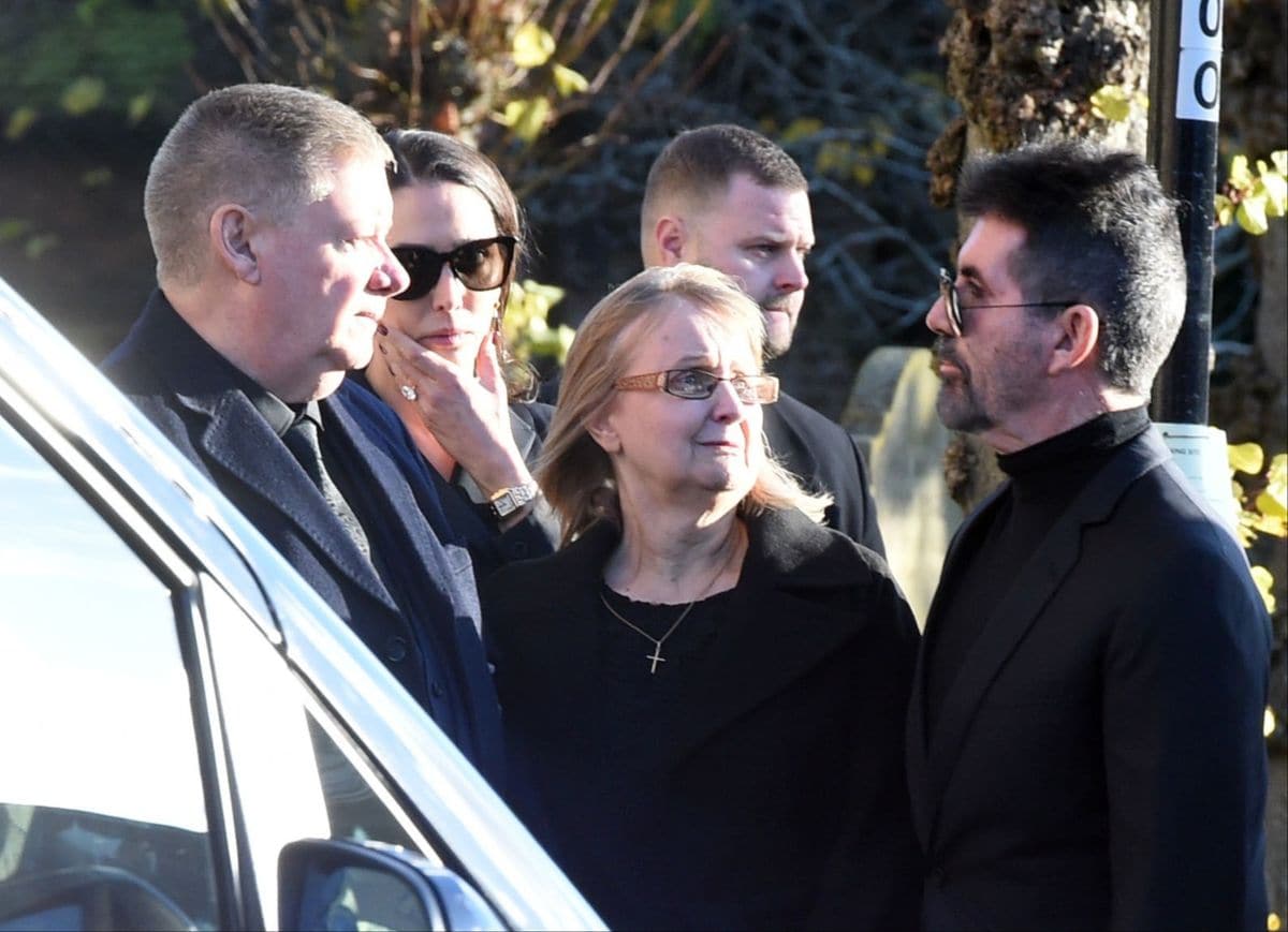 Simon Cowell pictured hugging Liam Payne's Mum  Karen and Dad Geoff goodbye alonside Lauren Silverman at Liam Payne's funeral. 