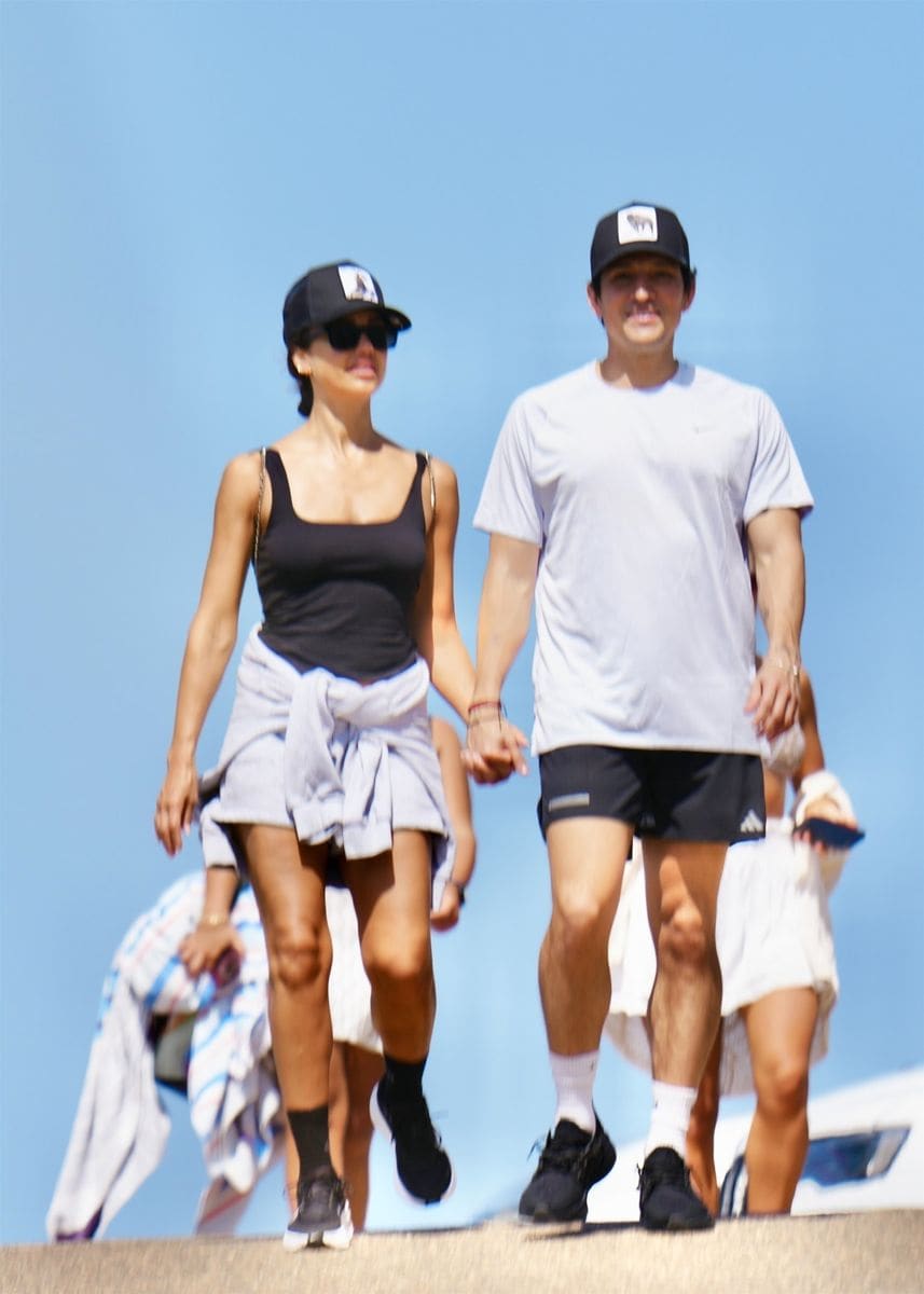 The two were spotted laughing, holding hands, and embracing as they wandered along the oceanfront path.