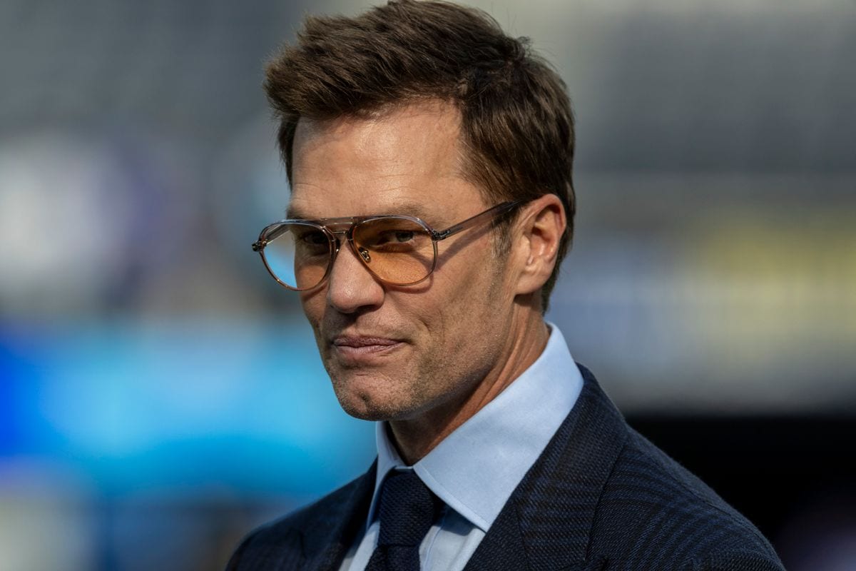 INGLEWOOD, CA - DECEMBER 14: Fox Sports commentator and former NFL quarterback Tom Brady on the field during pregame warmups before an NFL football game between the Detroit Lions and Los Angeles Rams at SoFi Stadium, December 14, 2025, in Inglewood, California. (Photo by Tony Ding/Icon Sportswire via Getty Images) 