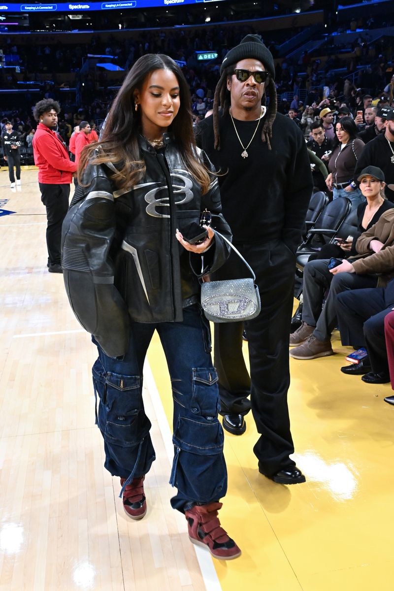 Jay-Z and Blue Ivy Carter attend a basketball game between the Los Angeles Lakers and San Antonio Spurs at Crypto.com Arena.