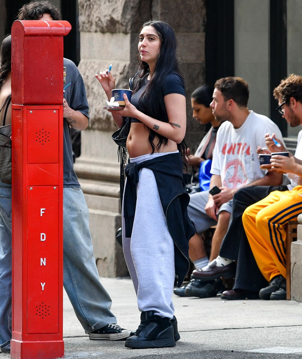 Lourdes Leon added a polished touch to her relaxed Manhattan look with a chic black shoulder bag tucked under her arm.