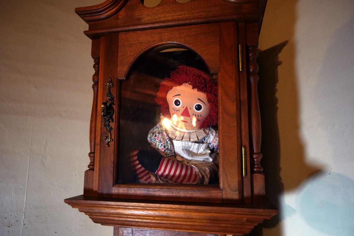  "Annabelle" doll in the house's living room at the "Conjuring" house in Harrisville, RI on Oct. 14, 2020. The house, a 3,100 square foot farmhouse and eight-acre property made famous by the movie series that began in 2013, is open for overnight stays. The owners are Jennifer and Cory Heinzen, paranormal investigators. (Photo by Barry Chin/The Boston Globe via Getty Images)