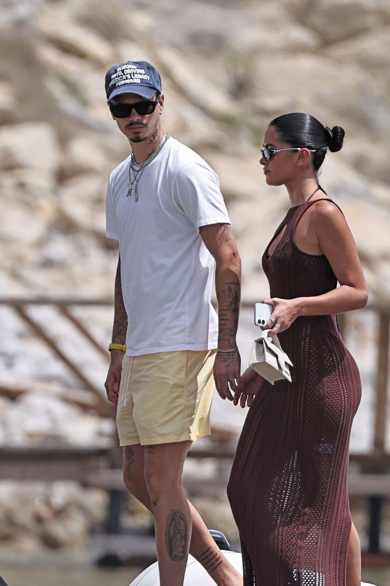 Romeo Beckham and Kim Turnbull coordinate relaxed summer style during the family outing in Ibiza.