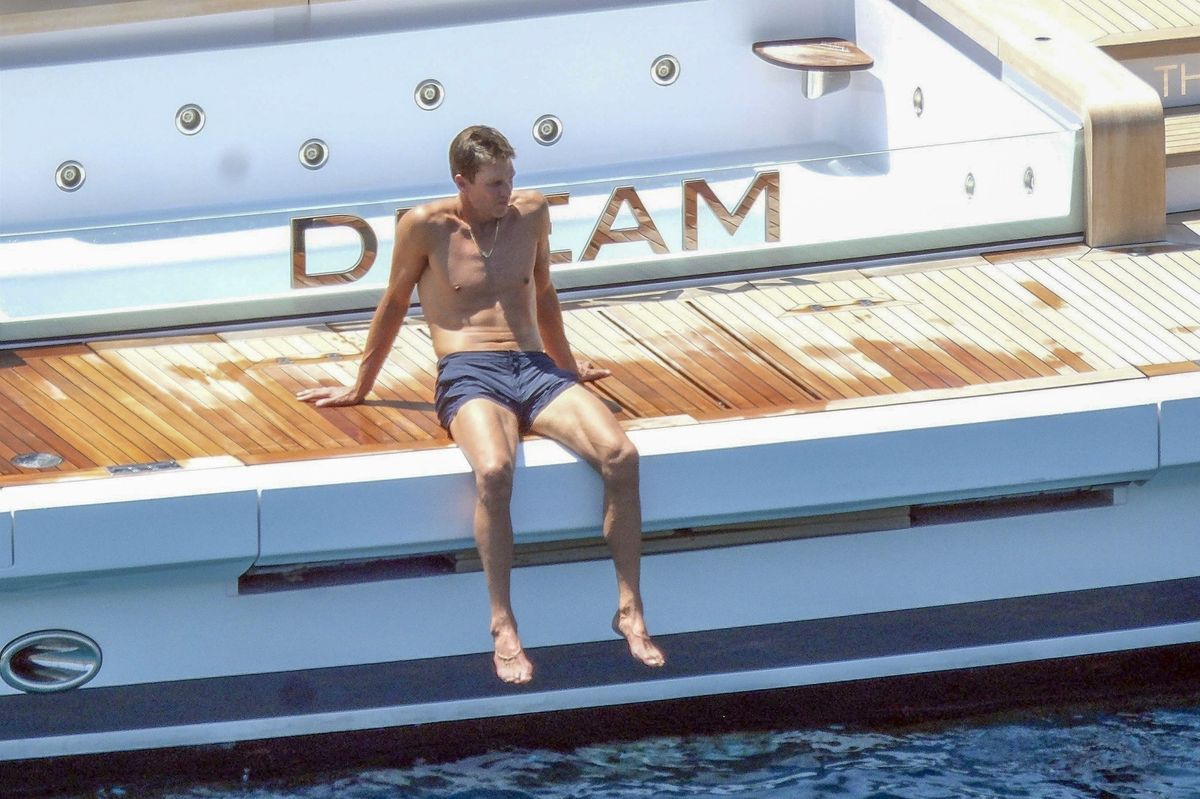 Tom showed off his tan and abs in Ibiza