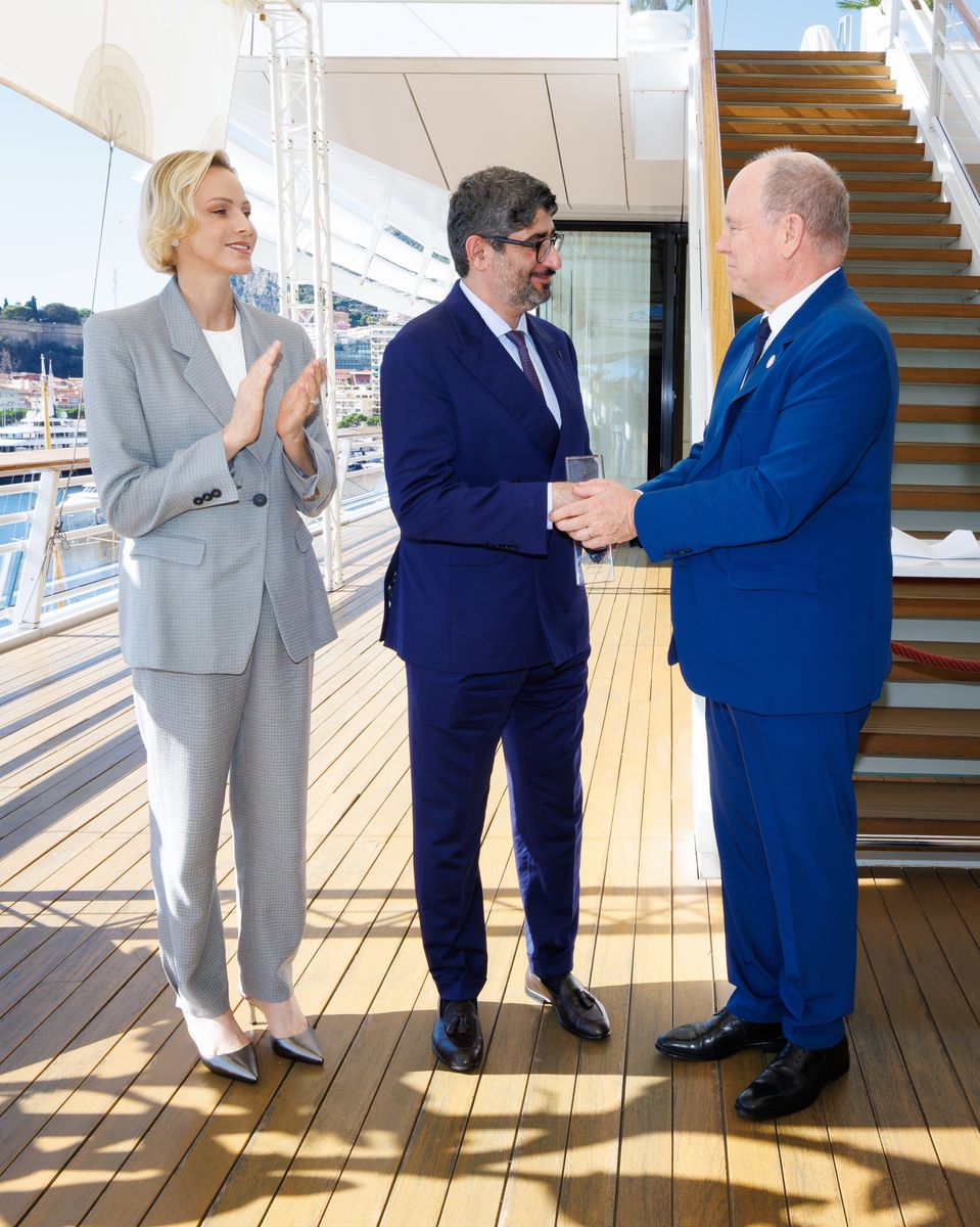 Princess Charlene paired a light-gray trouser suit with metallic pointed-toe heels for Monaco’s first philanthropy summit.