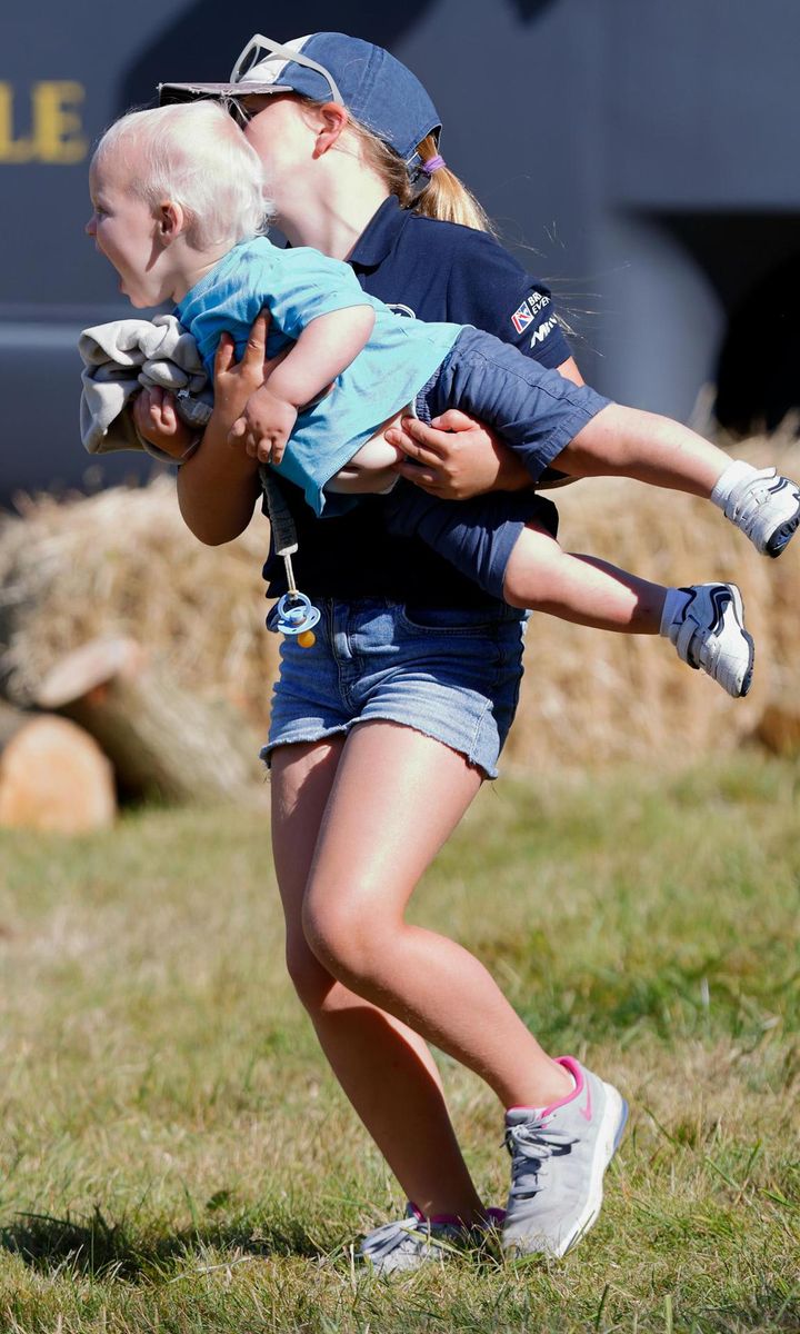 Big sister Mia Tindall gave her little brother a lift on Aug. 6.