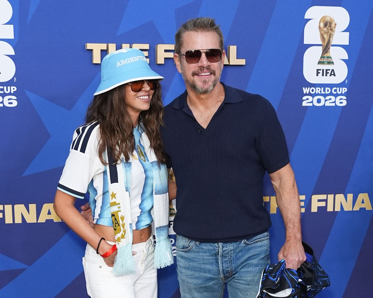Luciana and Matt posed together before taking their seats for the World Cup Final.