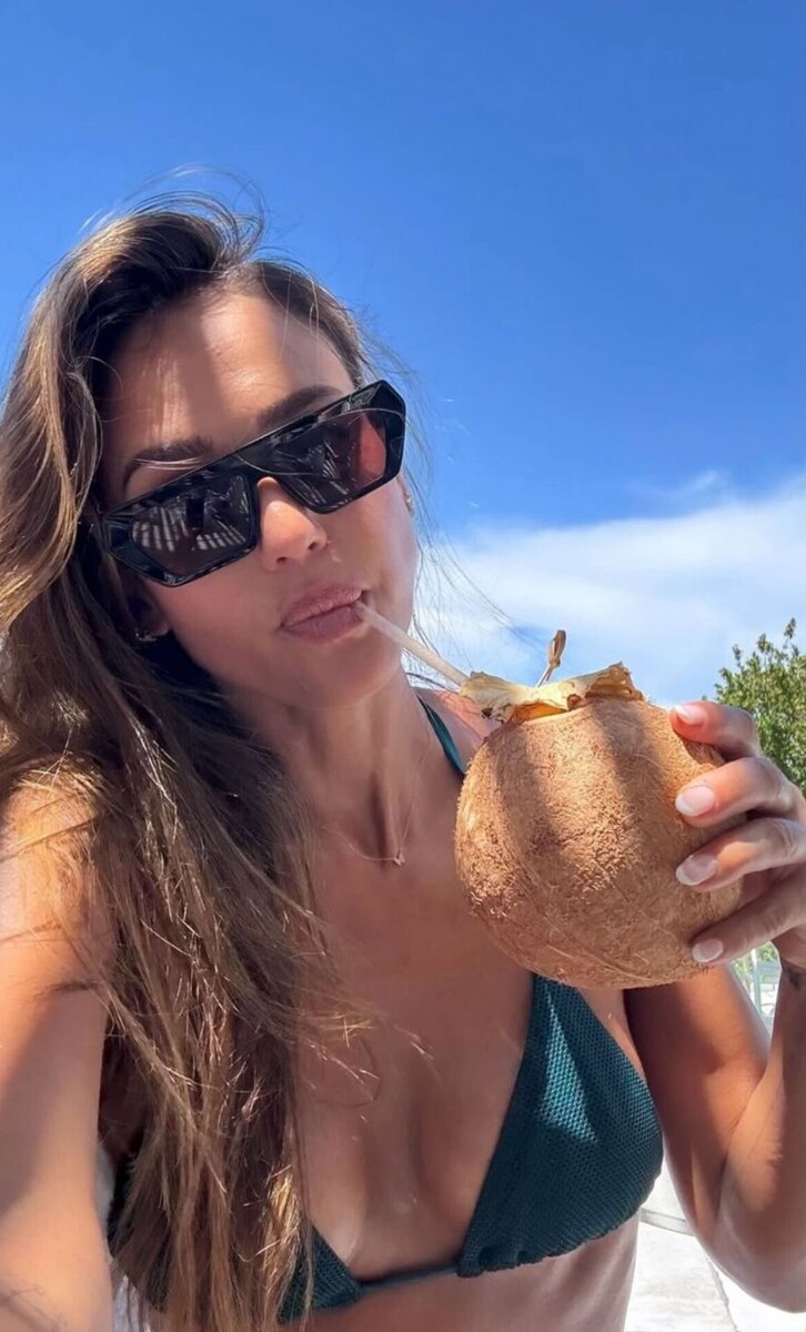Jessica Alba shares a candid moment sipping from a coconut, paired with a thoughtful post about being open to falling in love.