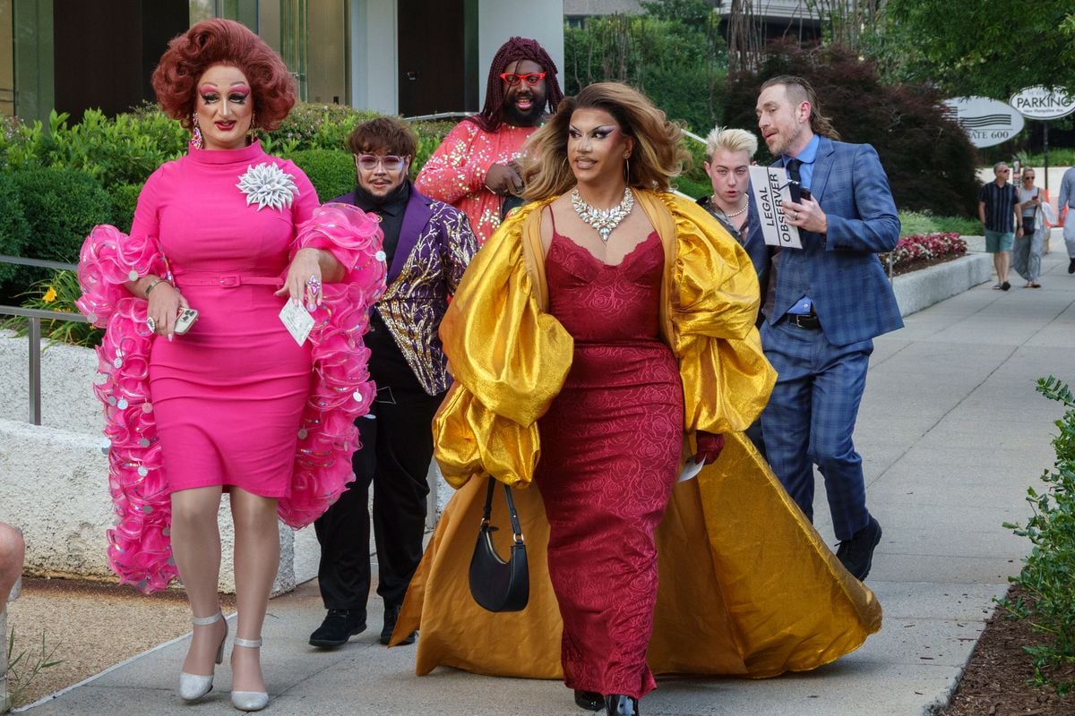 Guests, including several drag queens walk to the Kennedy Center to attend the opening performance of Les Miserables