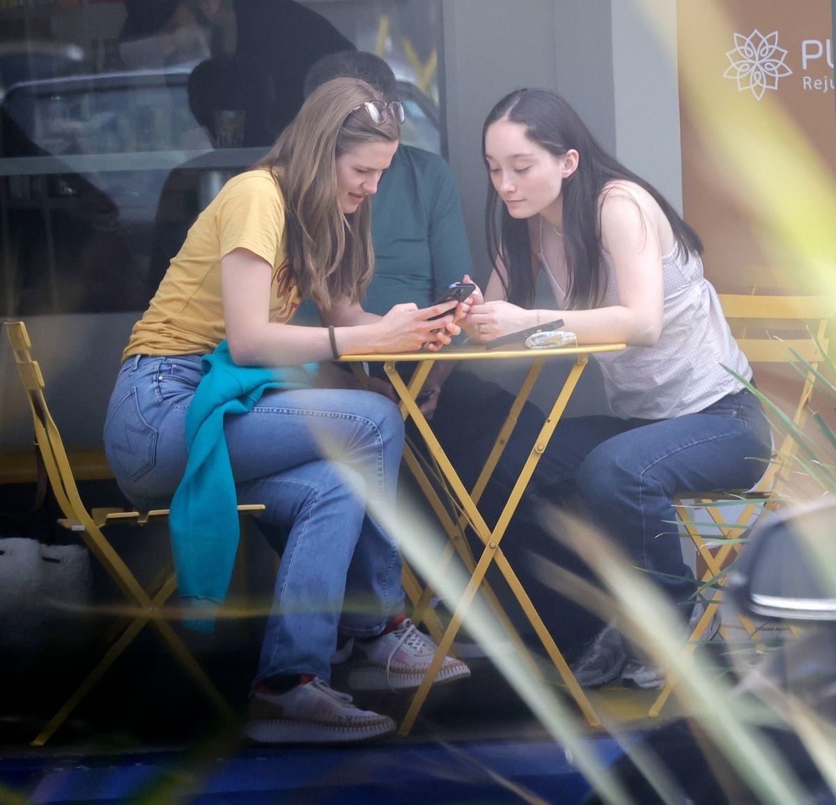 The pair shared laughs as they showed each other things on their phones