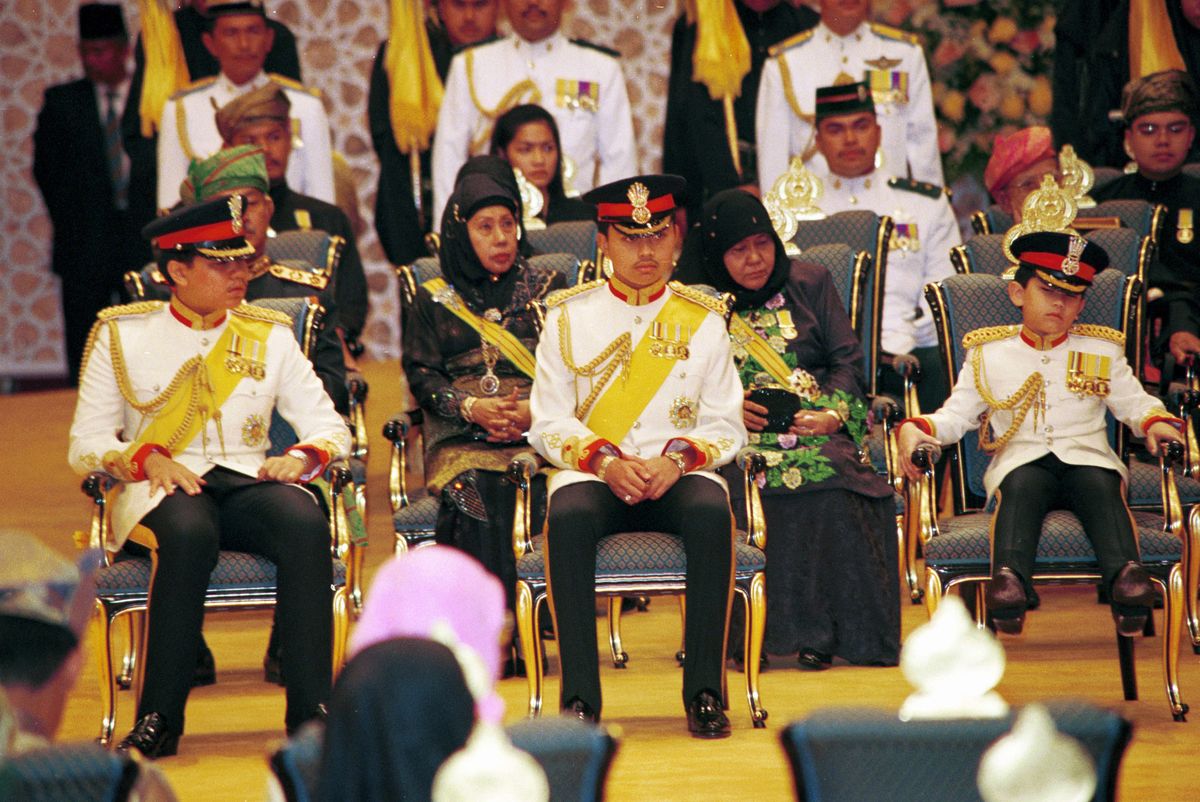 The other sons of the Sultan, Princes Abdul Azim, Abdul Malik & Abdul Matine, sunk into his chair.