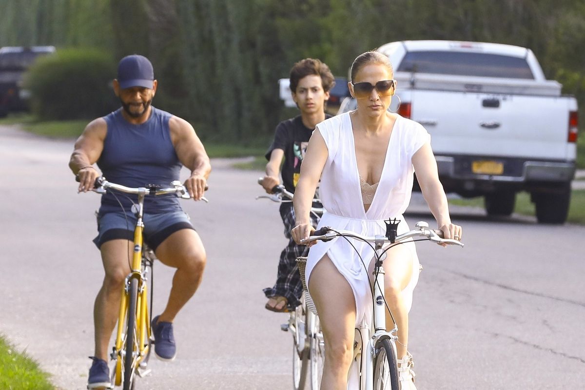  
Jennifer Lopez, accompanied by her manager Benny Medina and her son Max, is spotted riding bikes in The Hamptons. The trio enjoyed a leisurely outing, taking in the scenic views. 