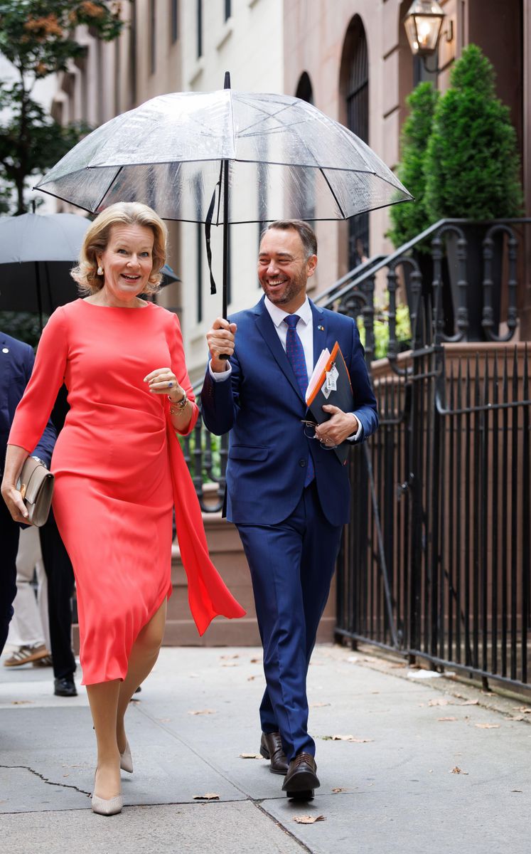 Queen Mathilde brought a bold pop of color to New York, pairing her elegant red dress with neutral pumps and a coordinating clutch.