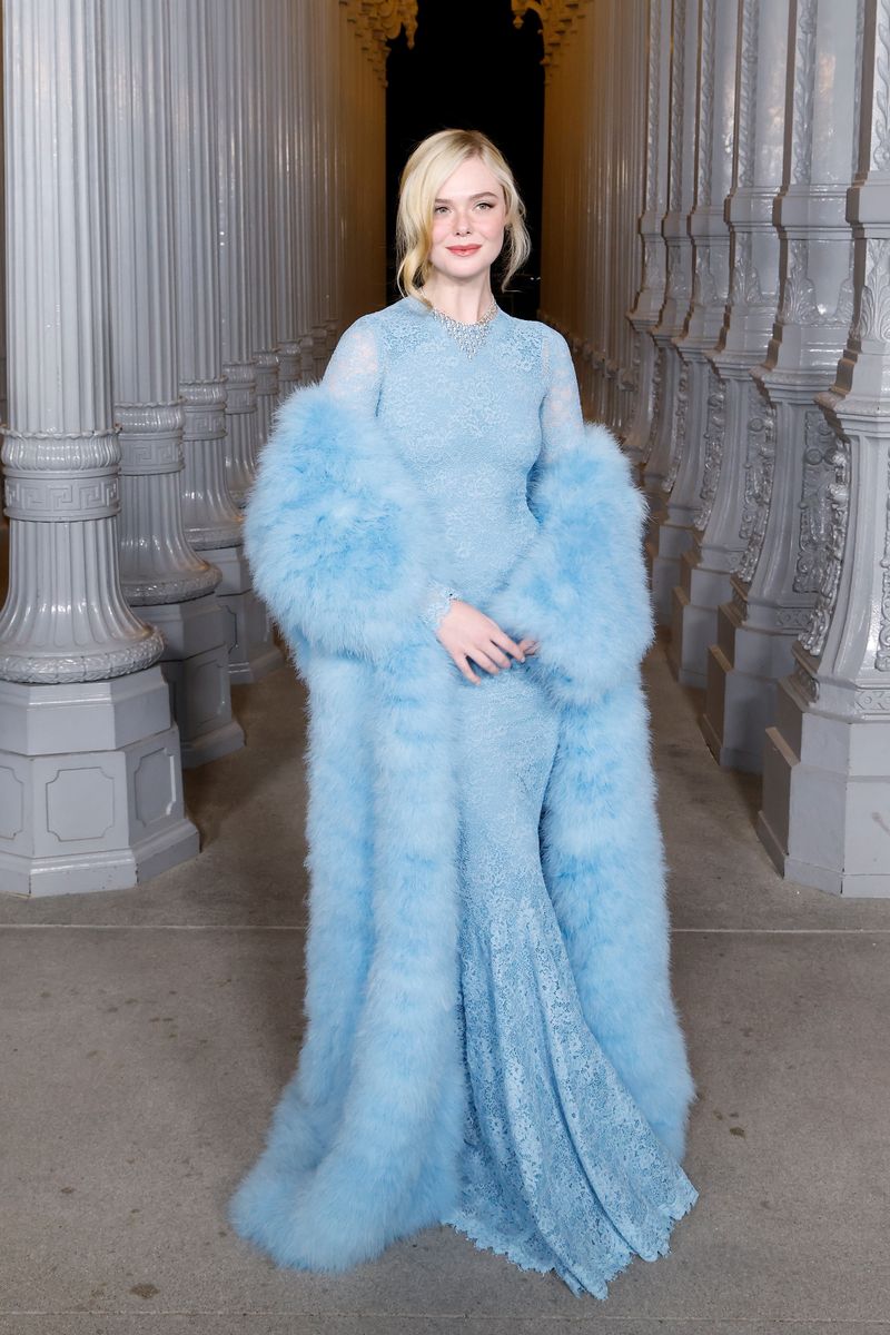 Dressed in a baby-blue lace gown and matching fur coat, Elle Fanning channeled the divas of the 1950s.