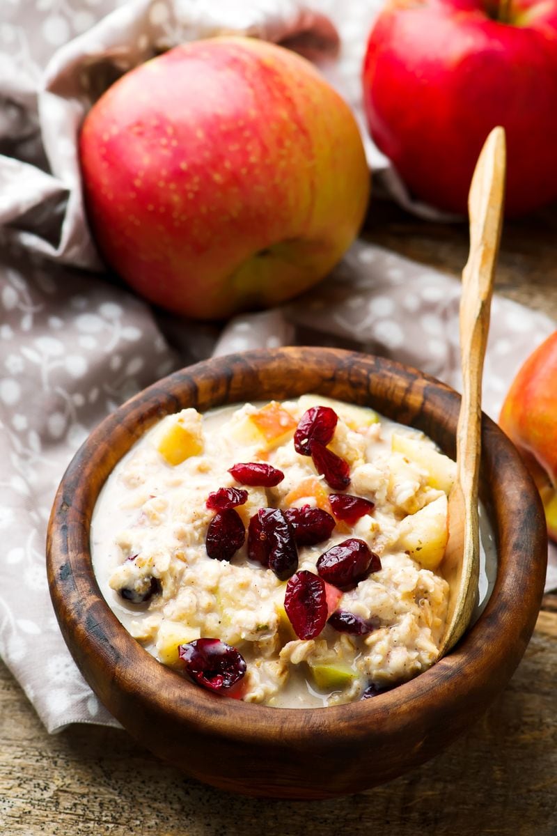 overnight oats with apples cranberry and cinnamon. selective focus