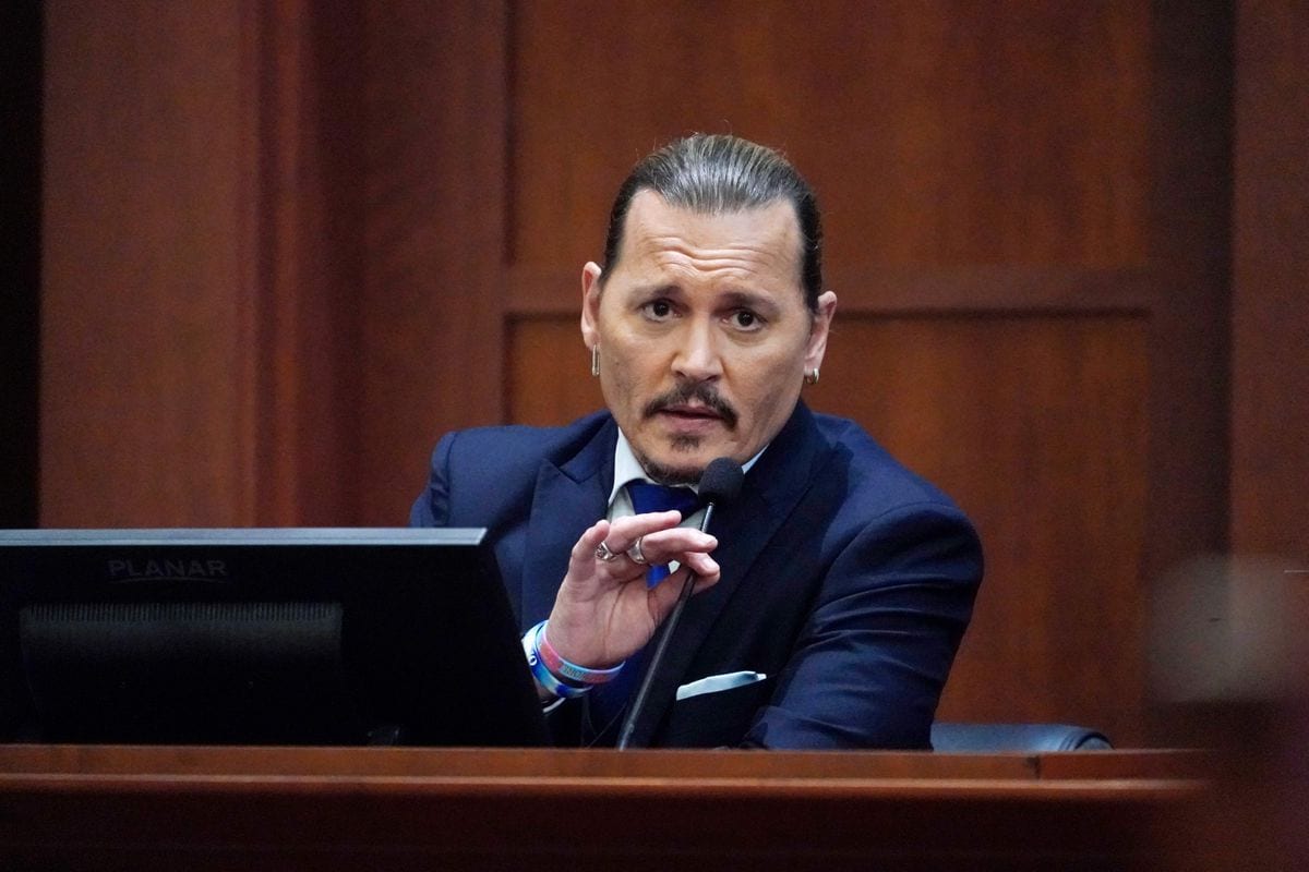 Johnny Depp testifies in the courtroom at the Fairfax County Circuit Courthouse in Fairfax, Virginia, April 25, 2022