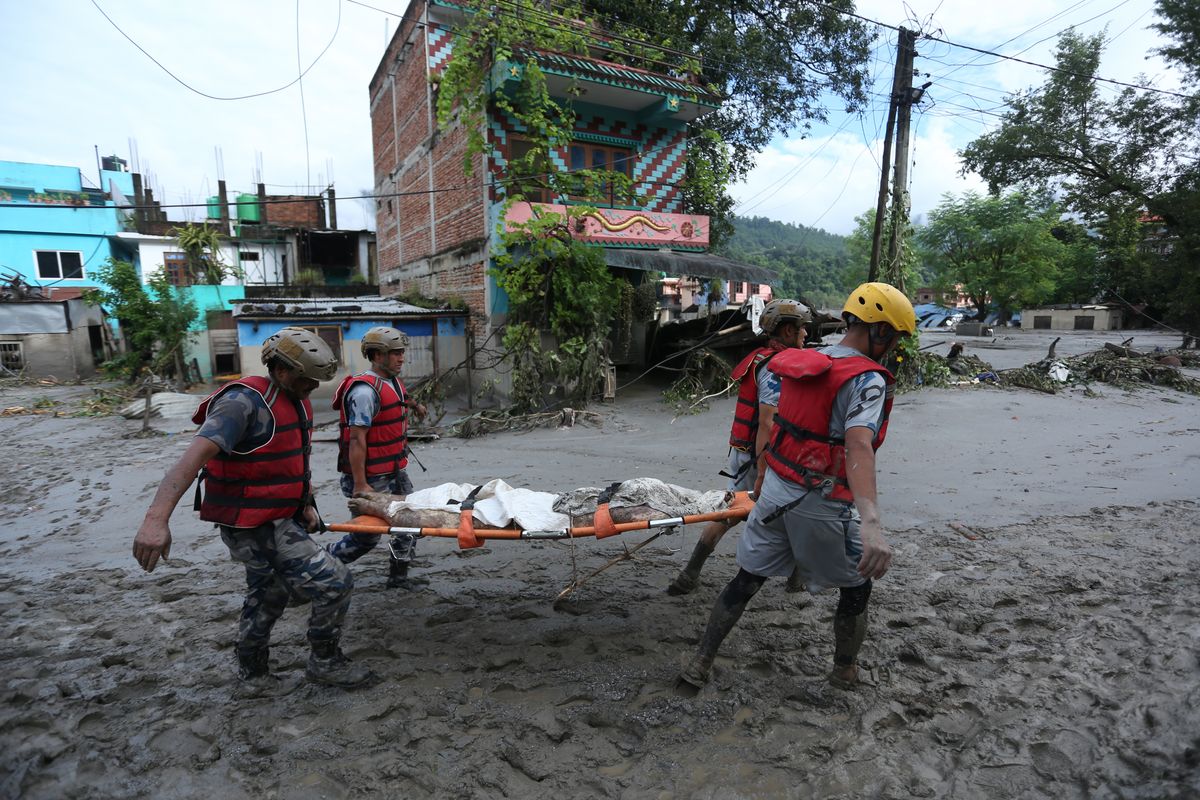 Devastating flooding along the Nepal-Tibet border swept away homes, roads and bridges, leaving hundreds dead and more than 1,000 people missing.
