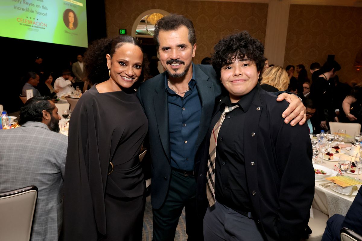 Judy Reyes and John Leguizamo pose with her son 
