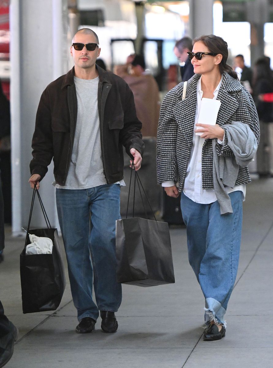 Katie Holmes and Jason Yarmosky arriving at JFK airport