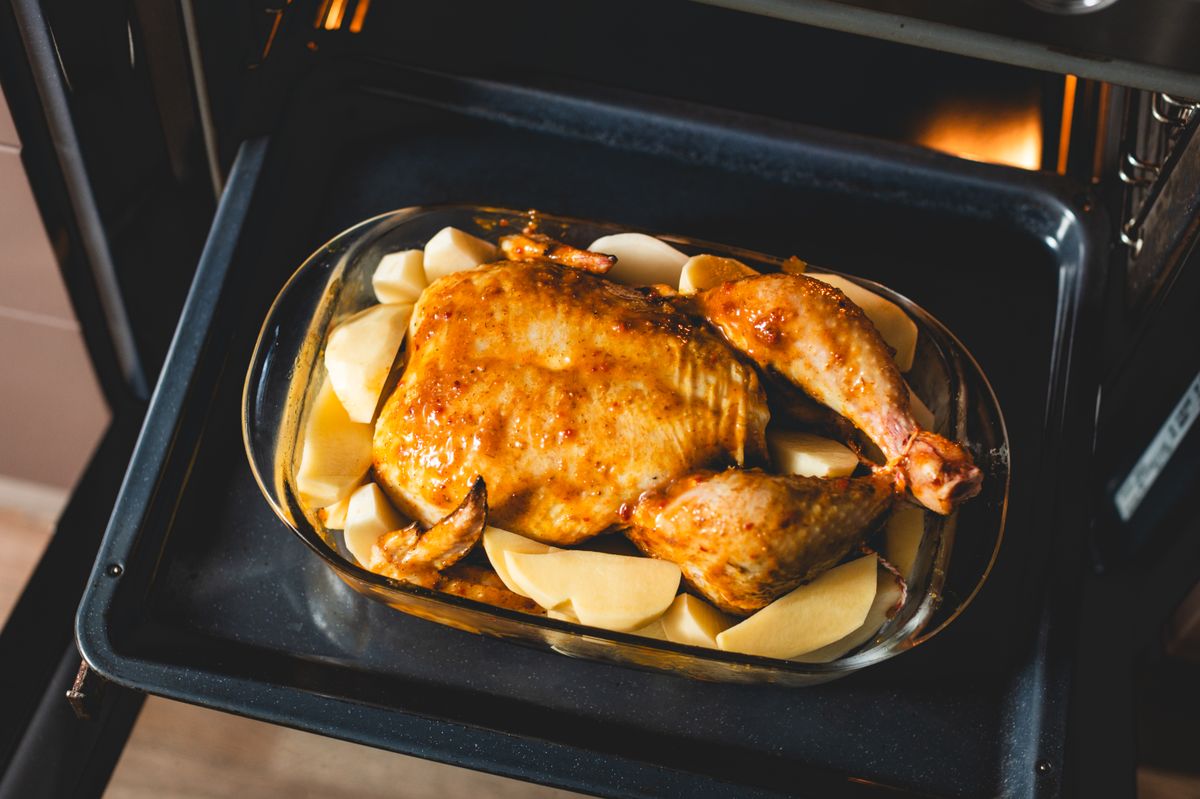 Begin on the lower rack to cook the meat through, then shift up for crisp skin.
