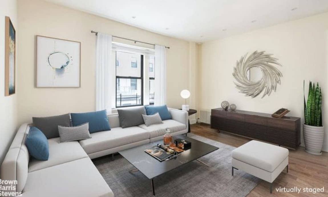 The virtually staged living room is light-filled and spacious.