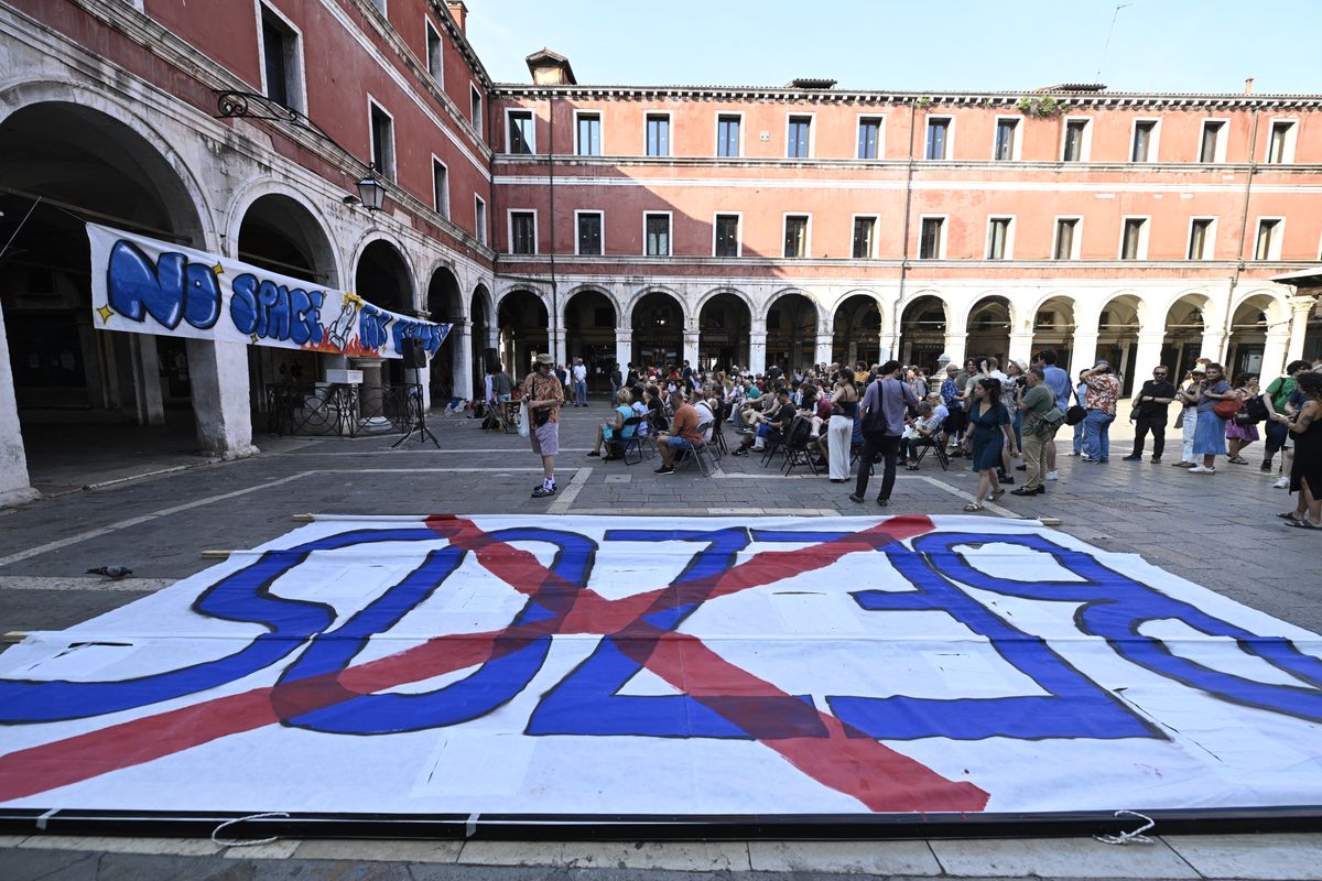 People gather to protest against the wedding of Amazon Founder and CEO Jeff Bezos and journalist Lauren Sanchez in Venice, on June 13, 2025.