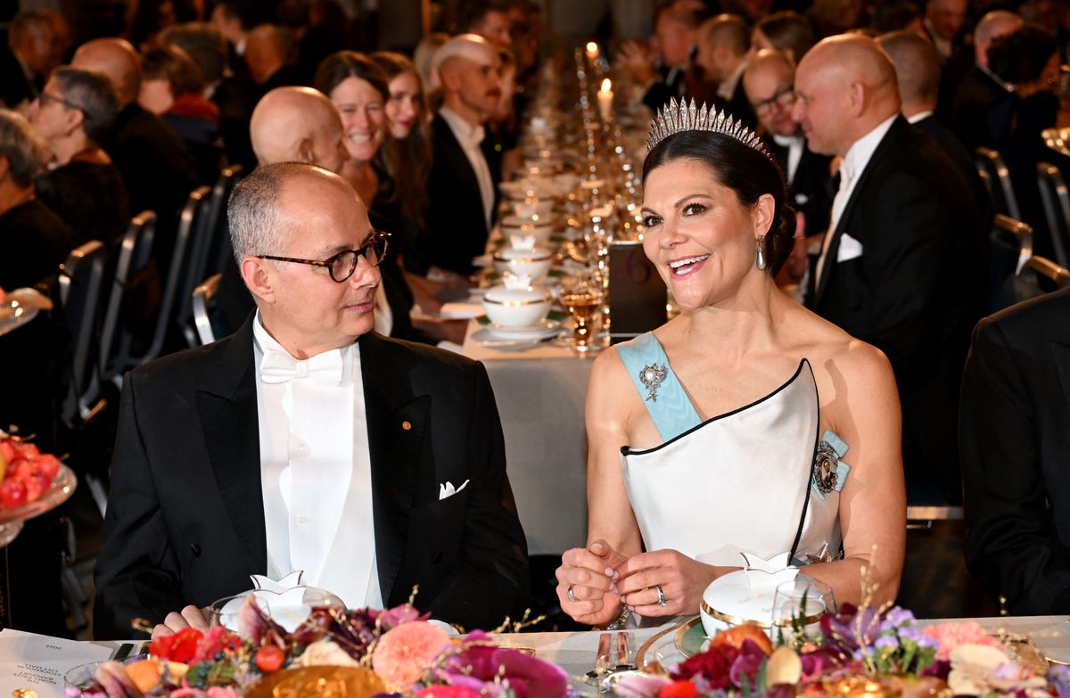Nobel Prize in Chemistry 2025 laureate US-Jordanian chemist Omar M Yaghi sits next to Crown Princess Victoria of Sweden as they attend the Nobel Prize banquet