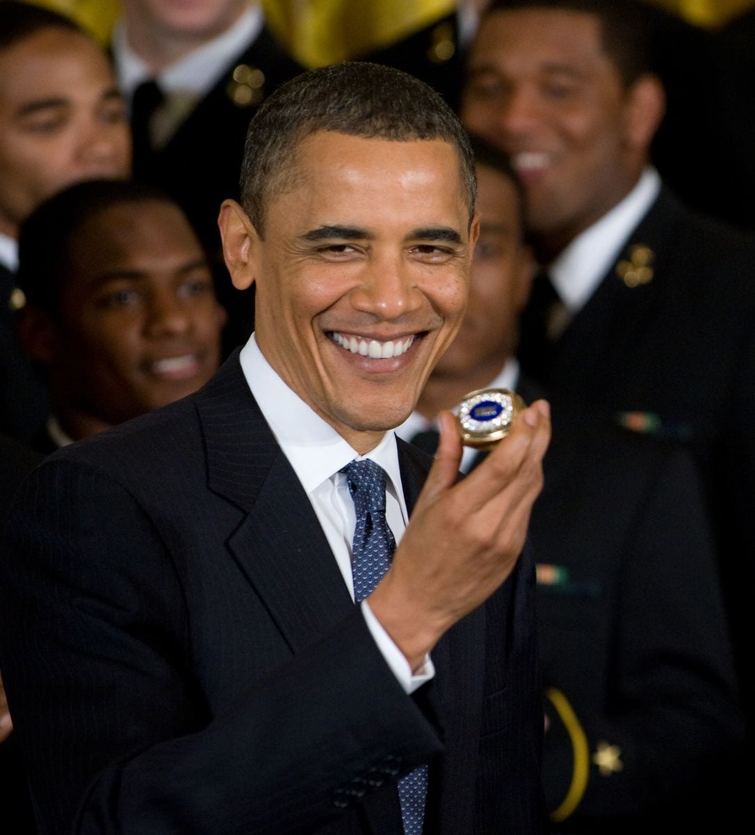 US President Barack Obama holds a US Naval Academy team ring during a ceremony where Obama presents the Commander in Chief trophy to the team in the East Room of the White House in Washington, DC, May 3, 2010. AFP PHOTO / Saul LOEB (Photo credit should read SAUL LOEB/AFP via Getty Images)