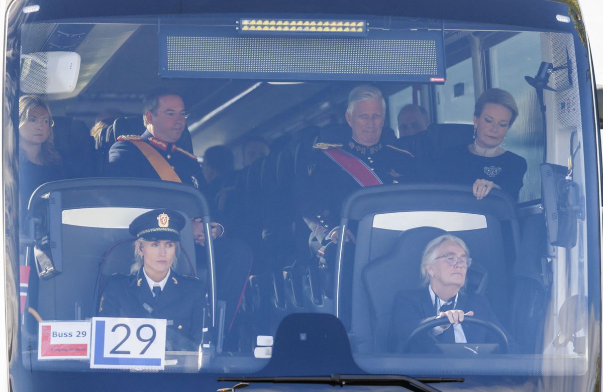 King Philippe of Belgium and Queen Mathilde of Belgium sit on board of a shuttle bus at Oslo Airport in Gardermoen Norway, on September 9, 2026, as they arrive to attend the funeral of late King Harald V of Norway