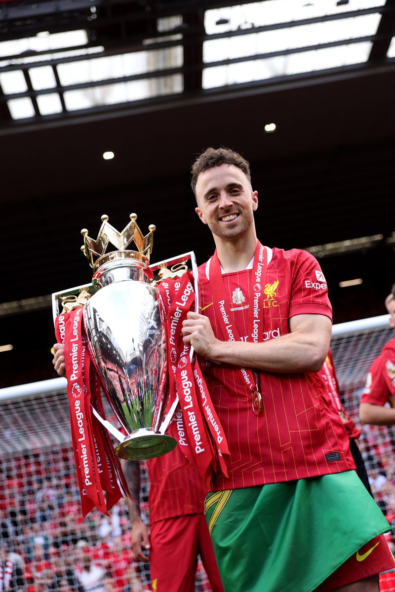 Diogo Jota of Liverpool  poses for a photograph with the Premier League trophy, as Liverpool are crowned the Champions of the Premier League, following the Premier League match between Liverpool FC and Crystal Palace FC at Anfield on May 25, 2025 in Liverpool, England. (Photo by Liverpool FC/Liverpool FC via Getty Images)