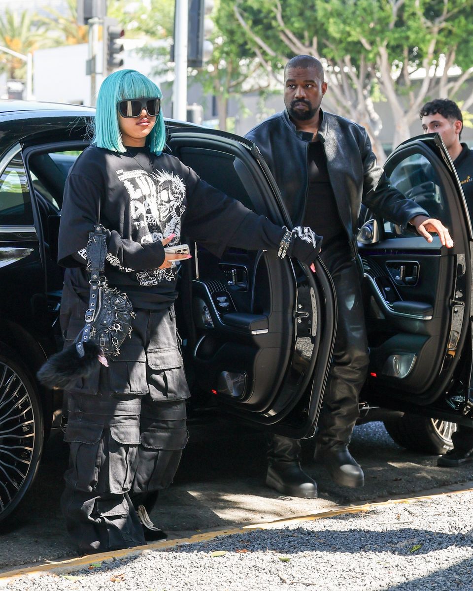 Kanye West, wife Bianca Censori, and Ye's daughter North West coordinated in matching black outfits as they headed to H. Lorenzo for a shopping spree on Thursday.