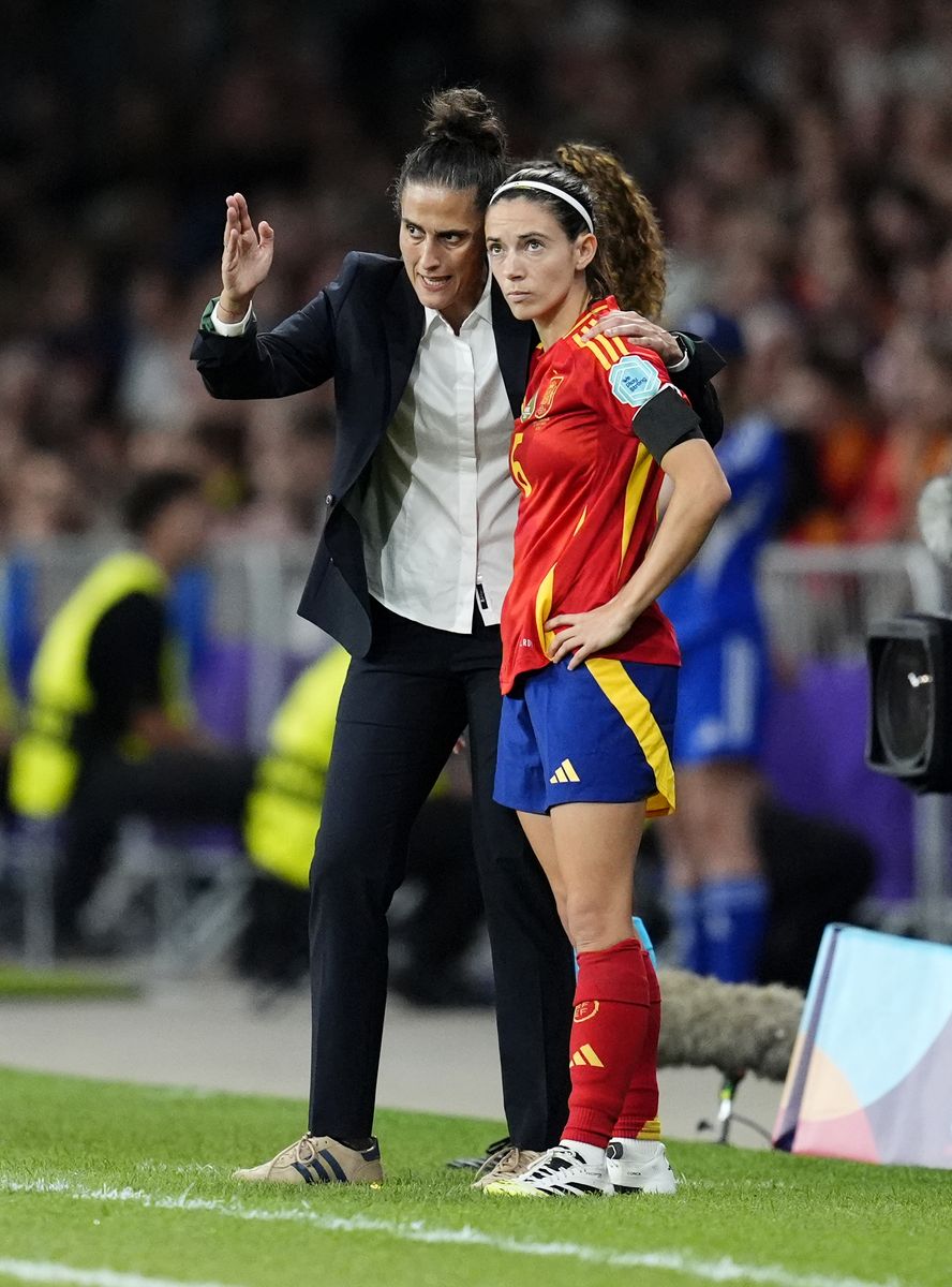 Spain head coach Montse Tome (left) speaks with player Aitana Bonmati before being substituted on during the UEFA Women's Euro 2025 Group B match at the Wankdorf Stadium in Bern, Switzerland.