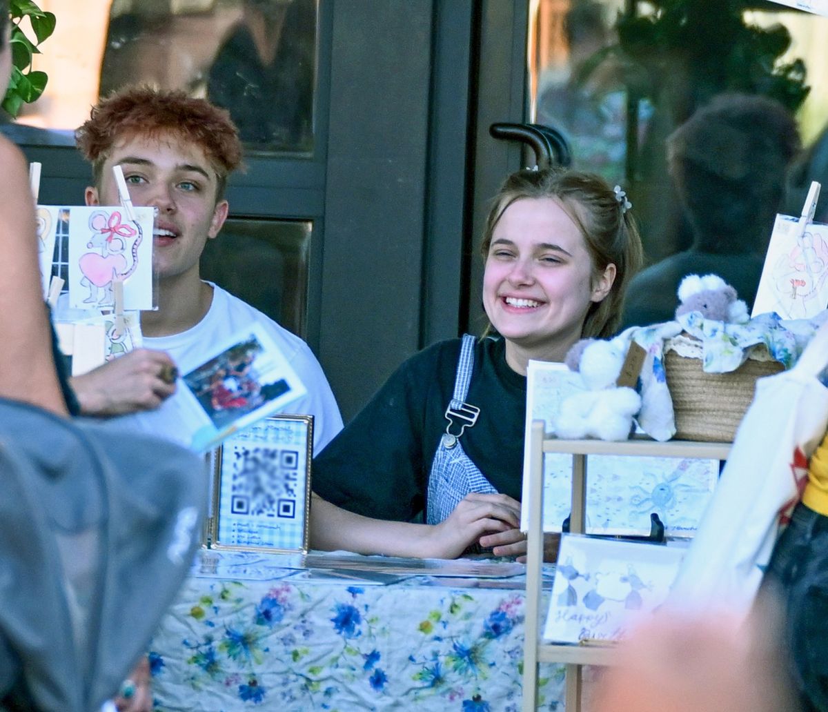 Knox and Vivianne were spotted selling some of Vivianne's artwork at a local fair