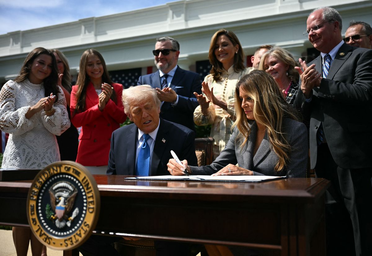 First lady Melania Trump signs the  TAKE IT DOWN Act alongside U.S. President Donald Trump