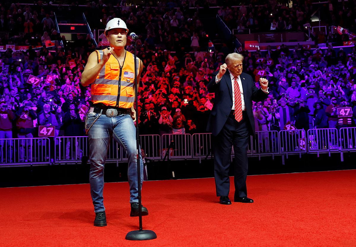 Donald Trump dances on stage while the Village People perform "YMCA"
