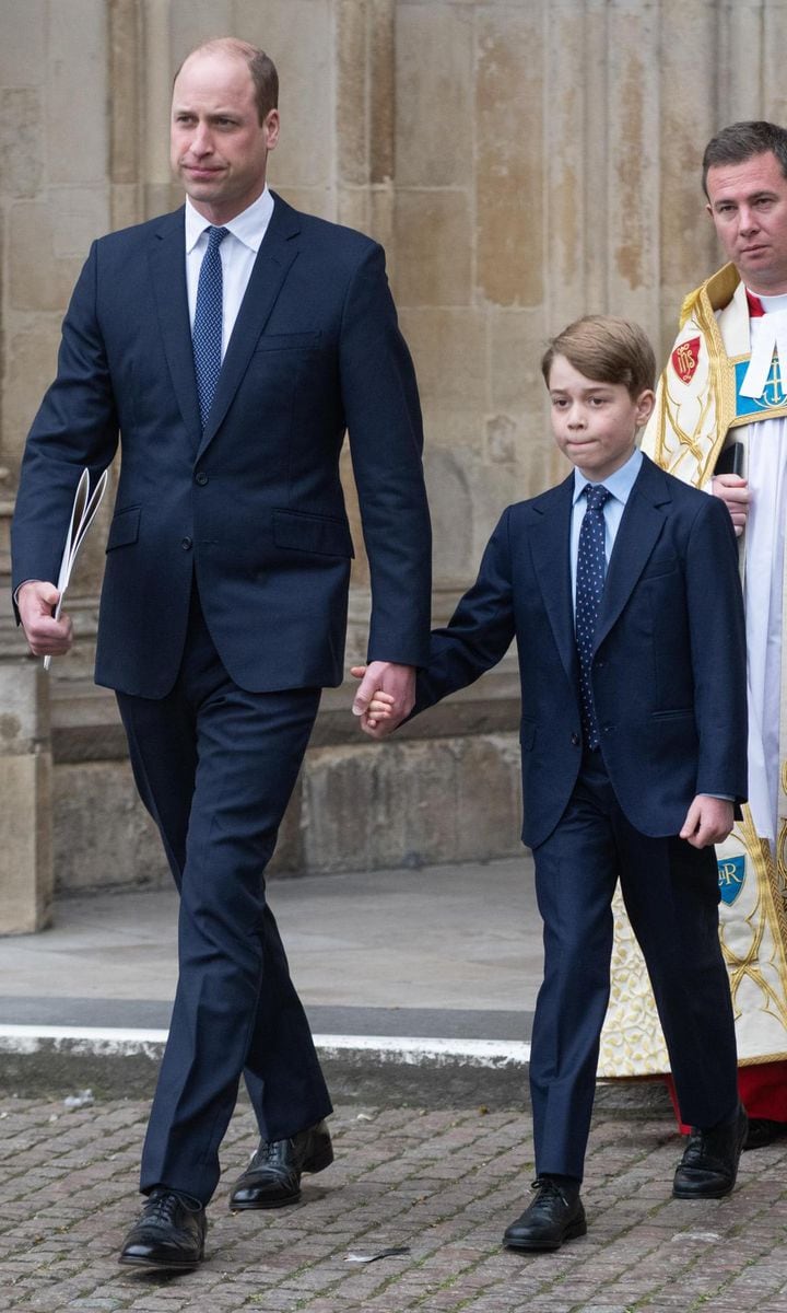Twinning future Kings! George looked like his fathers mini-me sporting a navy suit and printed blue tie.