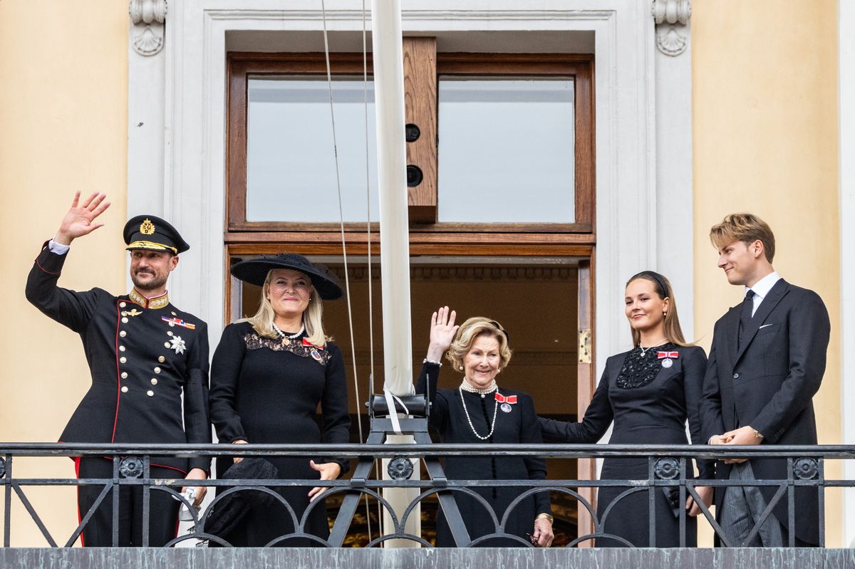 King Haakon, Queen Mette-Marit, Queen Sonja, Crown Princess Ingrid Alexandra, and Prince Sverre Magnus of Norway wave to the public during the funeral of King Harald V