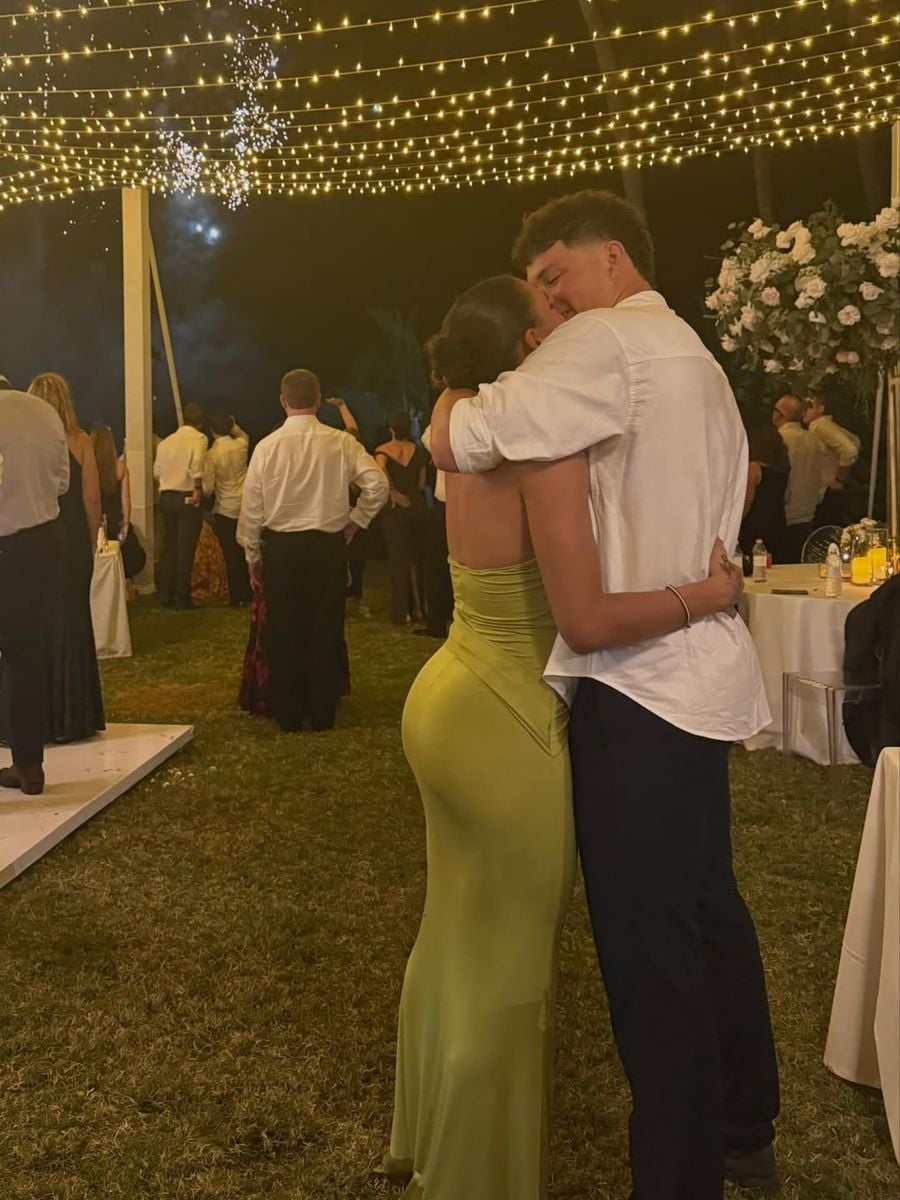 The couple shared a sweet kiss in the midst of the party