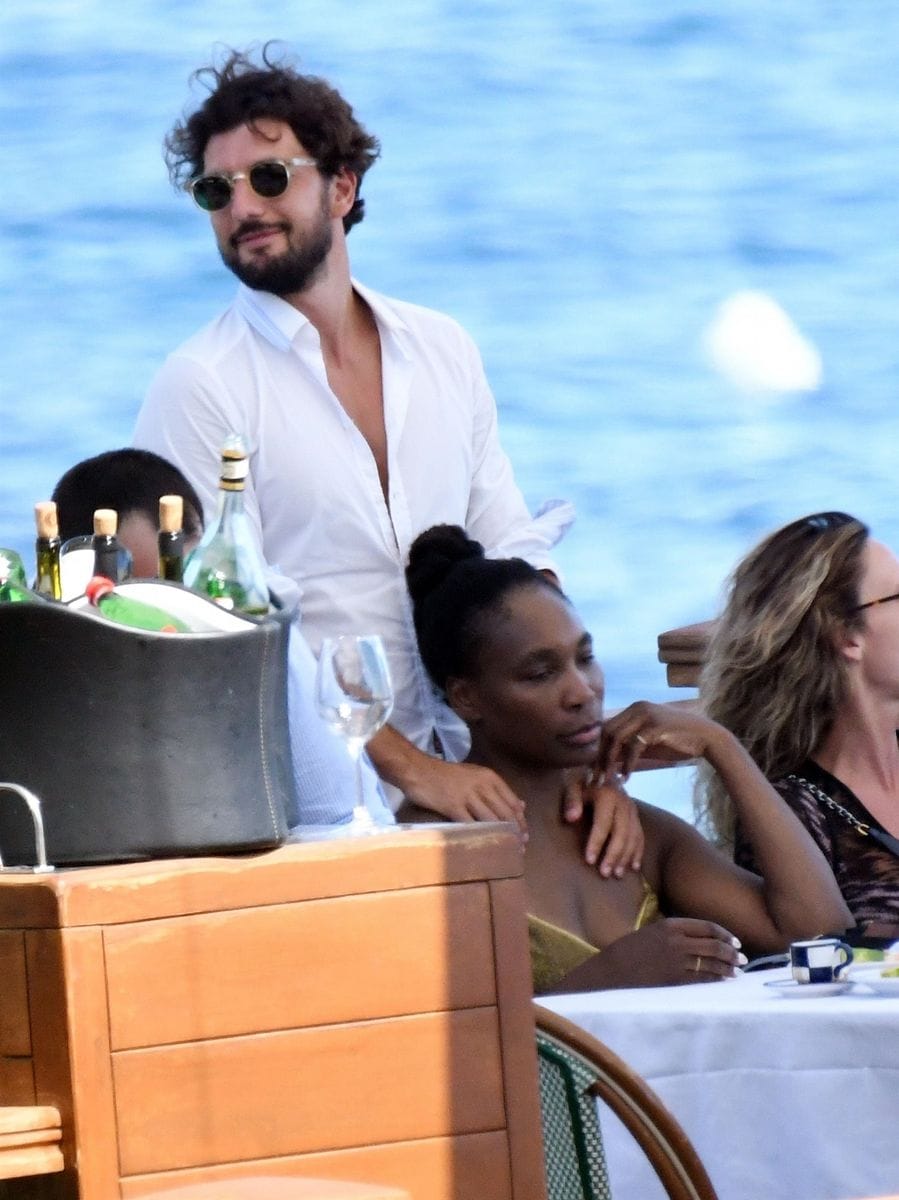 Venus Williams takes in the warm Italian sunshine in the company of Andrea Preti 
