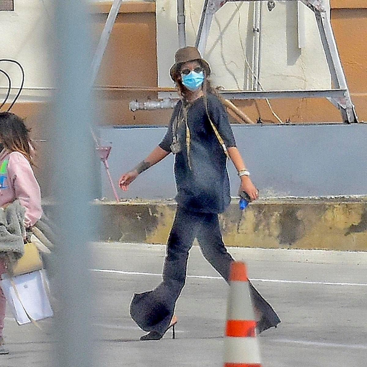 Rihanna pictured wearing a protective face mask and a lot of bling