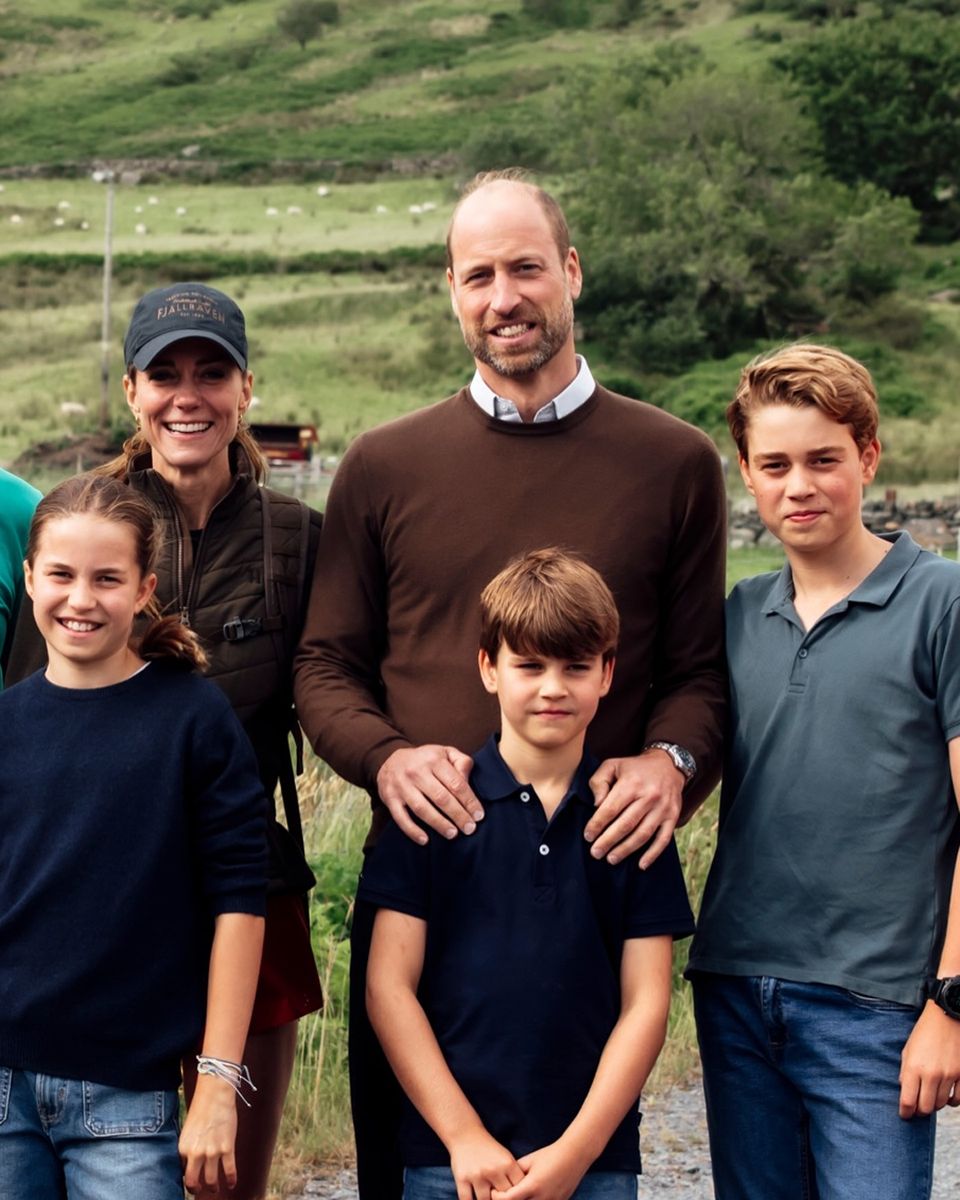 Prince George, Princess Charlotte and Prince Louis joined their parents for a photograph with mountain rescue volunteers during Kate’s summer challenge.