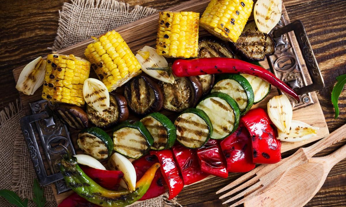 Homemade organic grilled summer vegetables on rustic table