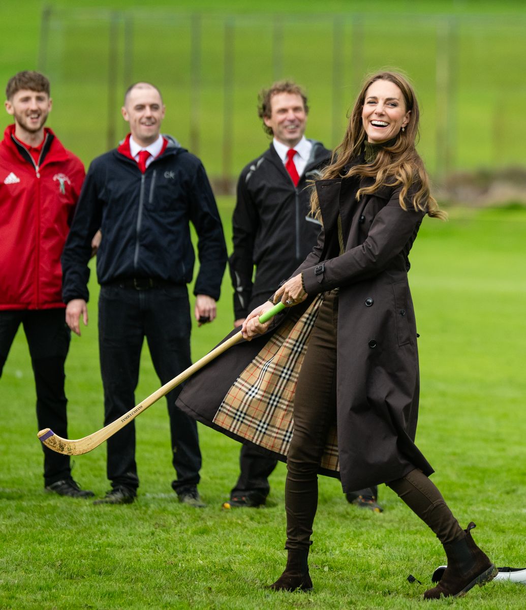 The Princess paired her diamond earrings with a chocolate brown trench, forest green knit and coordinating trousers for the Scottish outing.