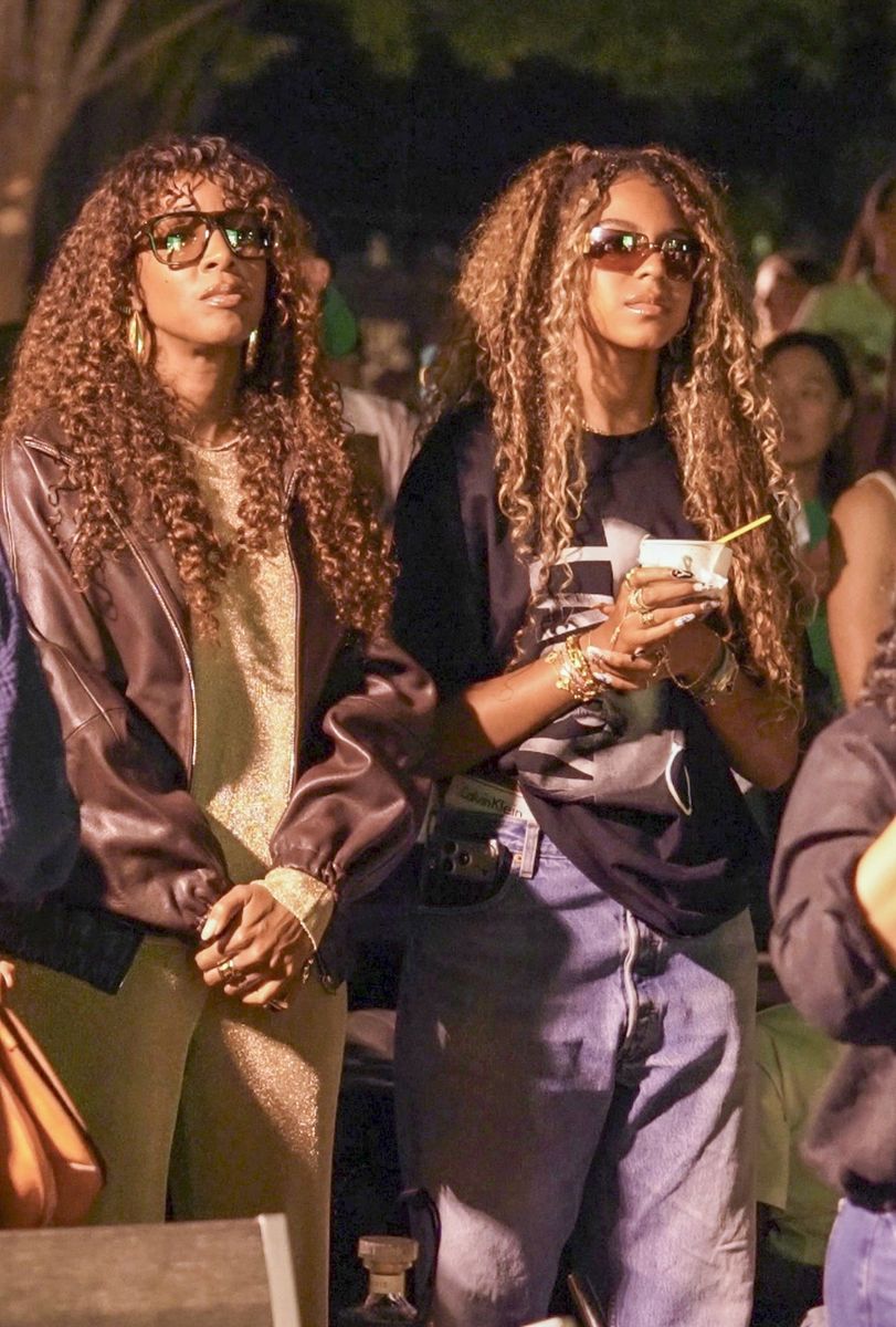 The singer wore a shimmering gold outfit paired with a brown leather jacket and oversized sunglasses while standing beside Blue Ivy 