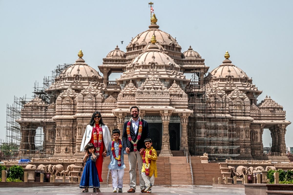 TOPSHOT - US Vice President JD Vance (2R) and his wife Usha Vance (2L), along with their children Ewan (C), Vivek (R) and Mirabel, pose for a photo in front of the Akshardham Temple in New Delhi on April 21, 2025. Vance begins a four-day visit to India on April 21 as New Delhi looks to seal an early trade deal and stave off punishing US tariffs. His tour includes a meeting with Indian Prime Minister Narendra Modi in New Delhi. (Photo by Kenny HOLSTON / POOL / AFP) (Photo by KENNY HOLSTON/POOL/AFP via Getty Images)          