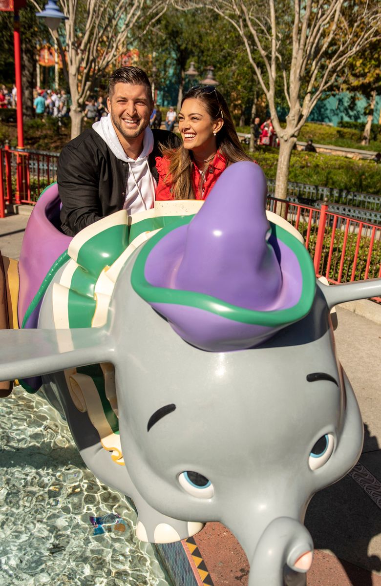  Tim Tebow and  Demi-Leigh Nel-Peters take flight on Dumbo at Magic Kingdom Park at Walt Disney World Resort while celebrating their recent engagement with family and friends on January 11, 2019 in Lake Buena Vista, Florida.  (Photo Kent Phillips/Disney Parks via Getty Images)