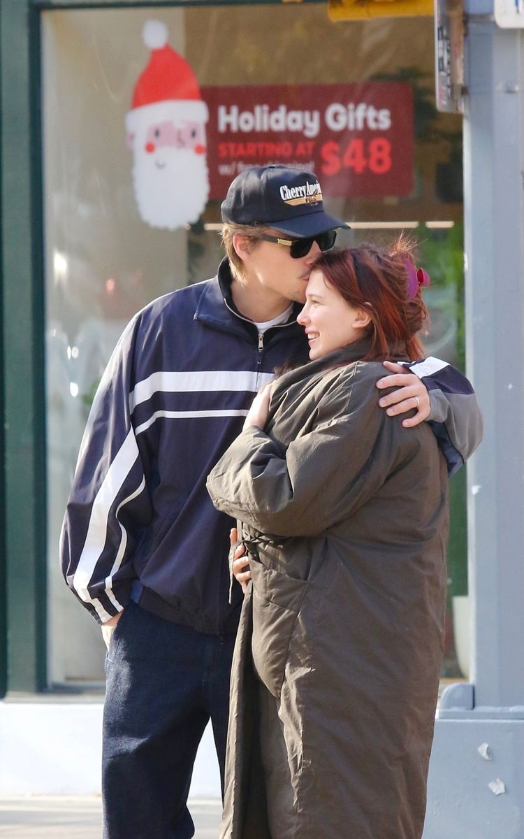 The couple shared a sweet kiss as they waited to cross the street