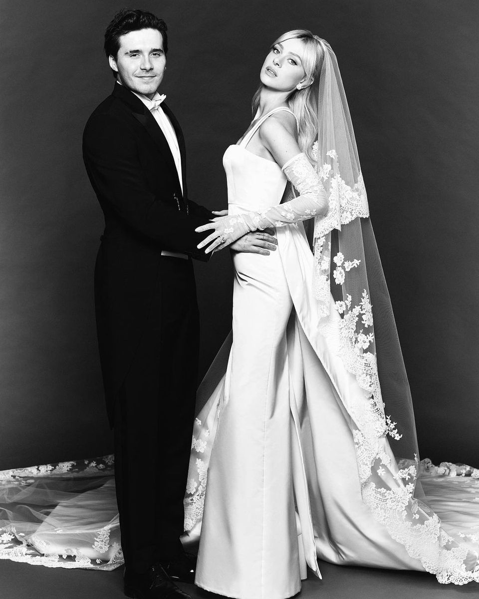 Nicola Peltz, marrying Brooklyn Beckham in 2022, chose a modern, square-necked Valentino gown